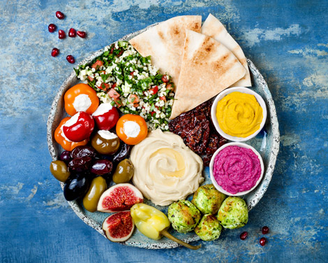 flat lay of Lebanese style food on blue table top